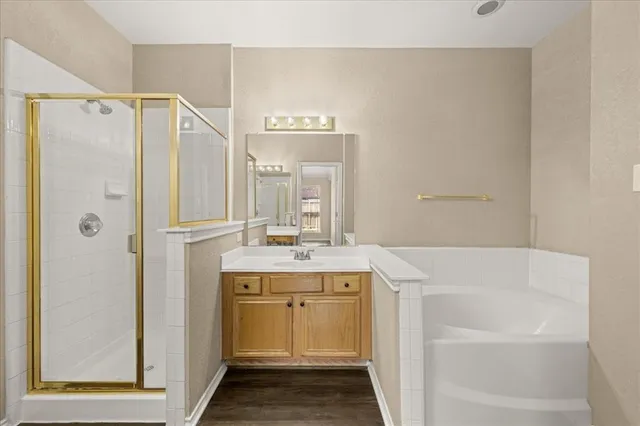 a bathroom with a sink a mirror and a shower