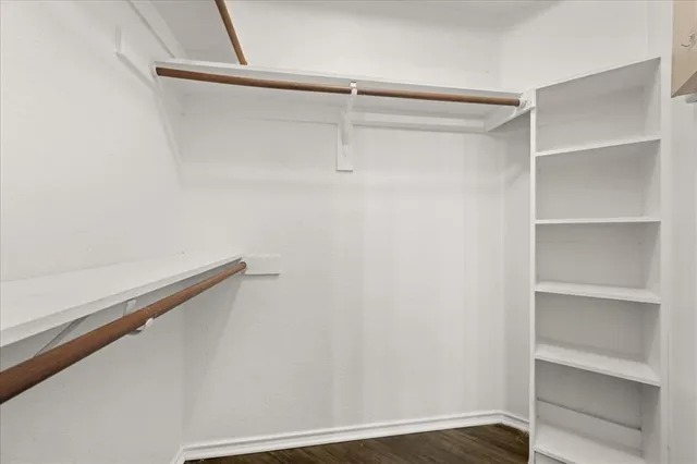 a view of an empty walk in closet