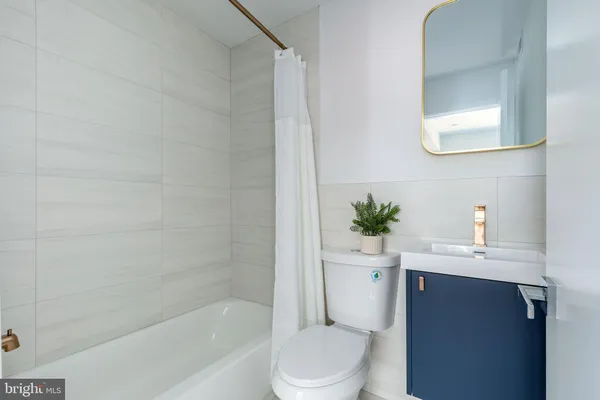 a bathroom with a sink toilet and a bathtub