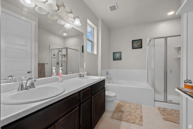 1074 South 750 West Springville, UT 84663 - Photo 15 of 28 Bathroom featuring a dual vanity with undermount sinks, a white countertop, and dark wood-finish cabinetry
