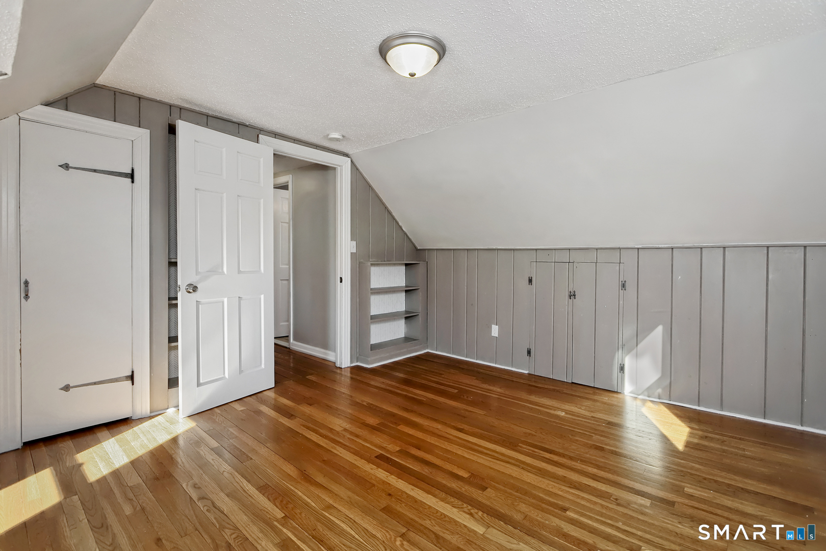 10 Hemingway Road North Haven, CT 06473 - Photo 27 of 38 2nd floor BR, hardwood floors closet and built-ins
