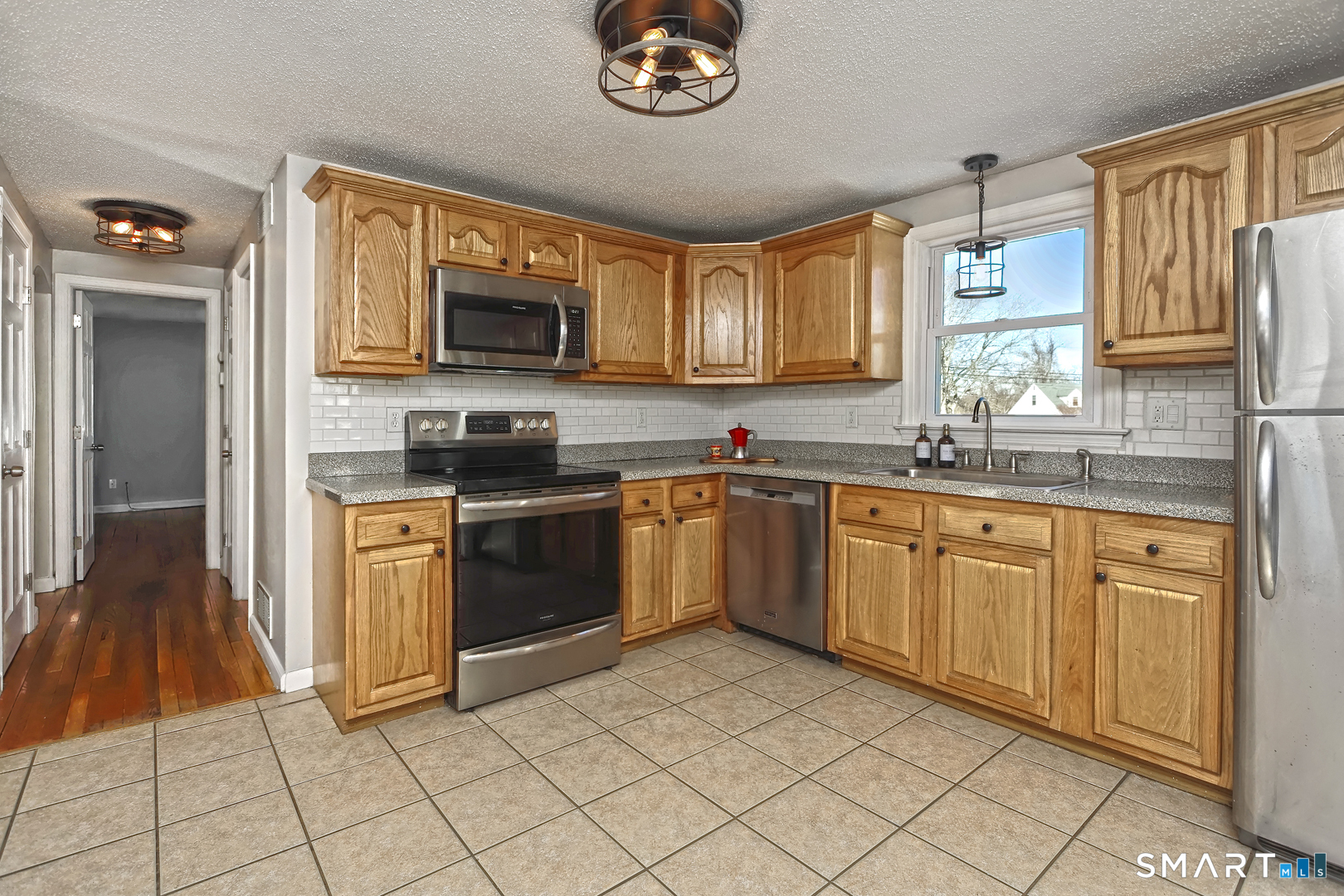 10 Hemingway Road North Haven, CT 06473 - Photo 3 of 38 Plenty of cabinets. Kitchen window looks out into backyard