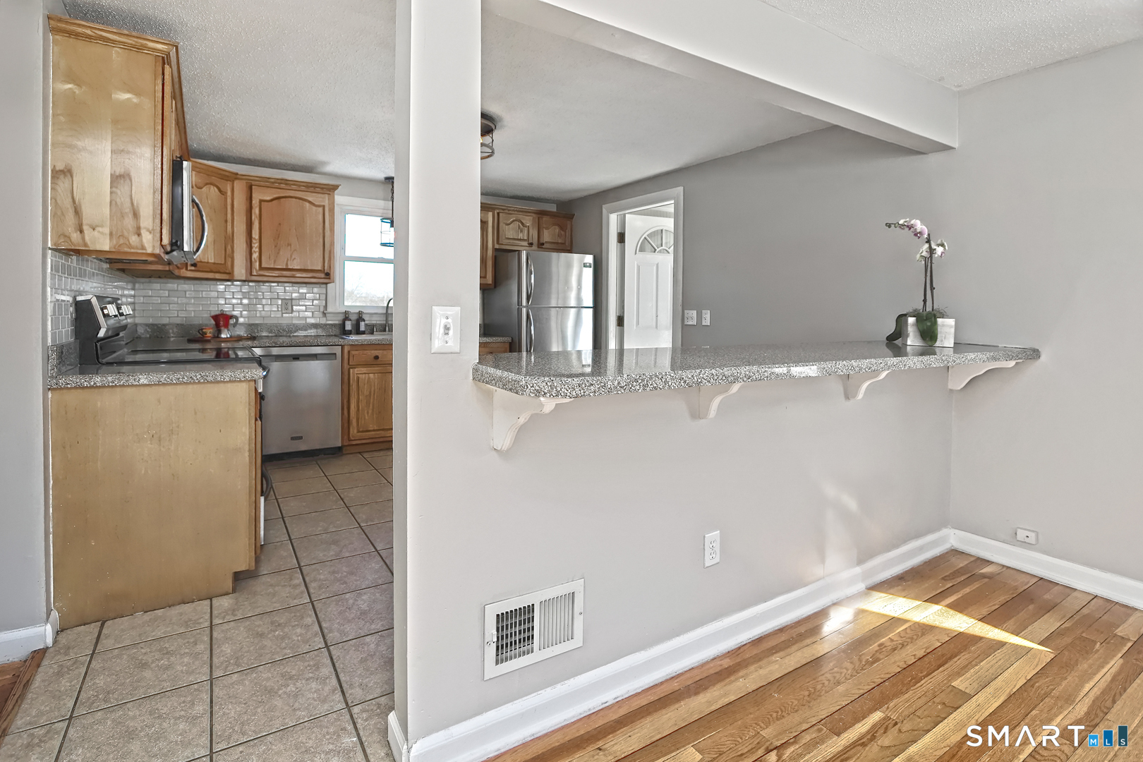 10 Hemingway Road North Haven, CT 06473 - Photo 6 of 38 Kitchen opens to dining area with lots of natural light