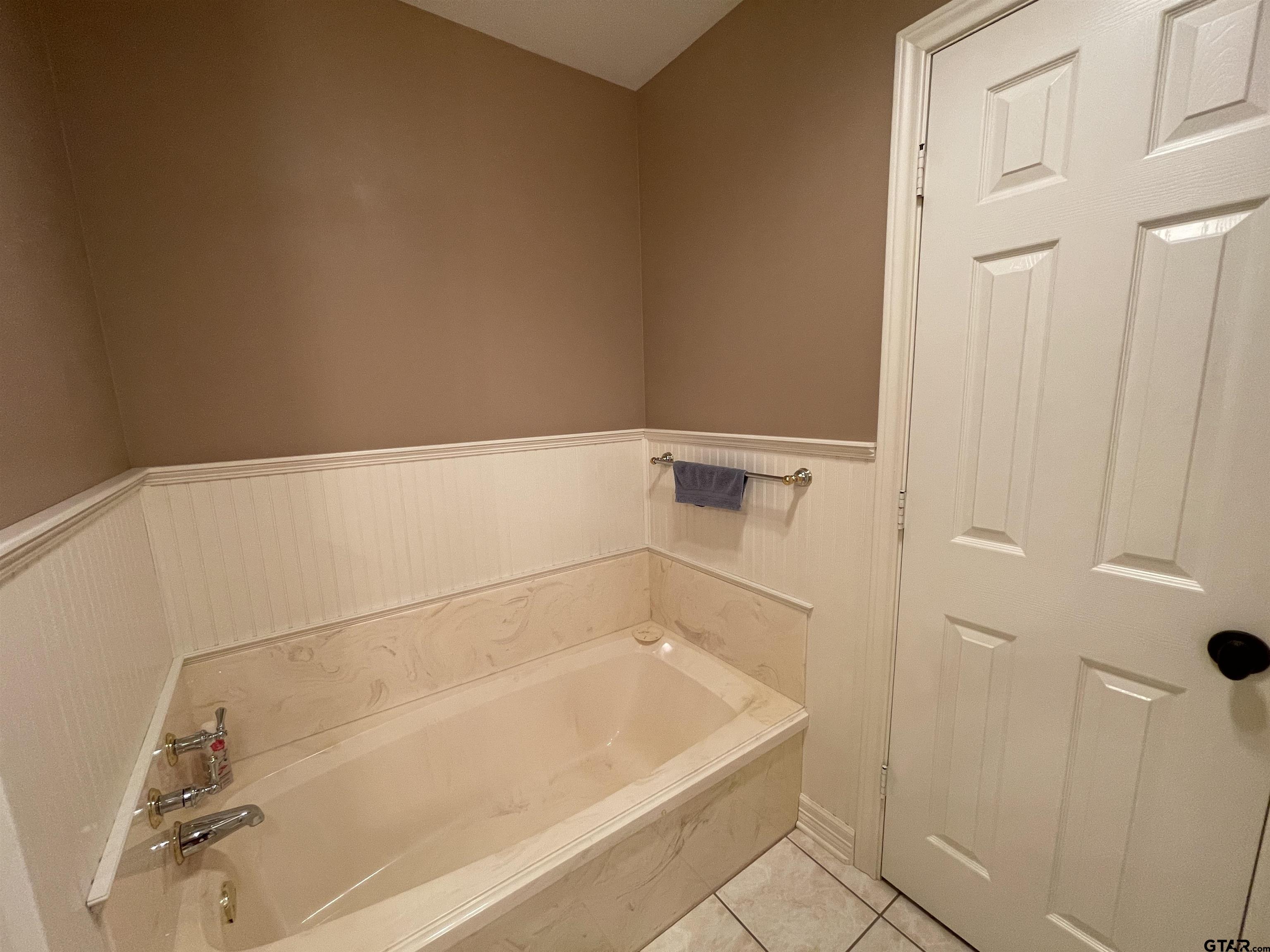 3617 Flagstone Drive Tyler, TX 75707 - Photo 13 of 45 a bathroom with a bathtub
