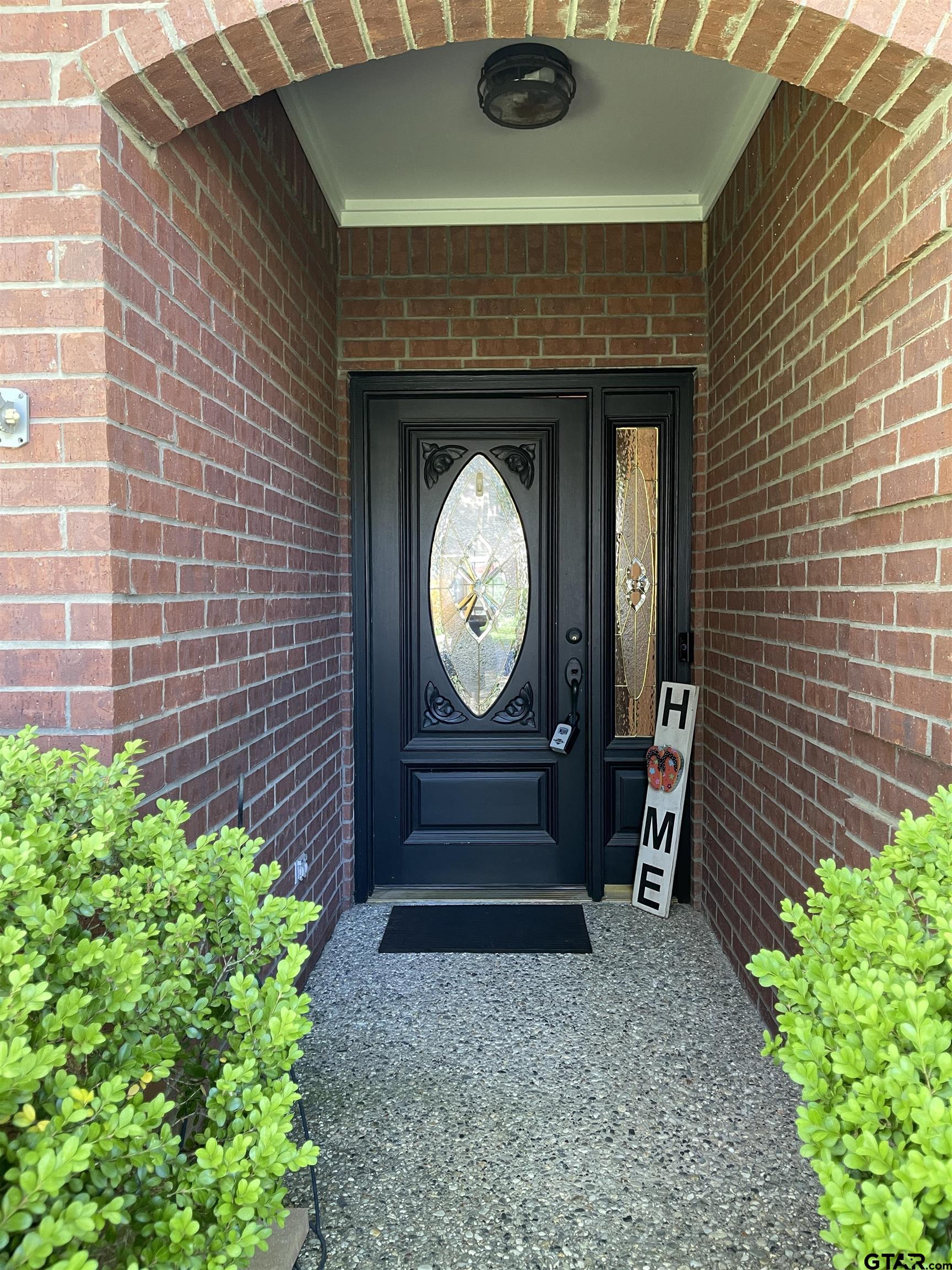 3617 Flagstone Drive Tyler, TX 75707 - Photo 2 of 45 a front view of a house with garden