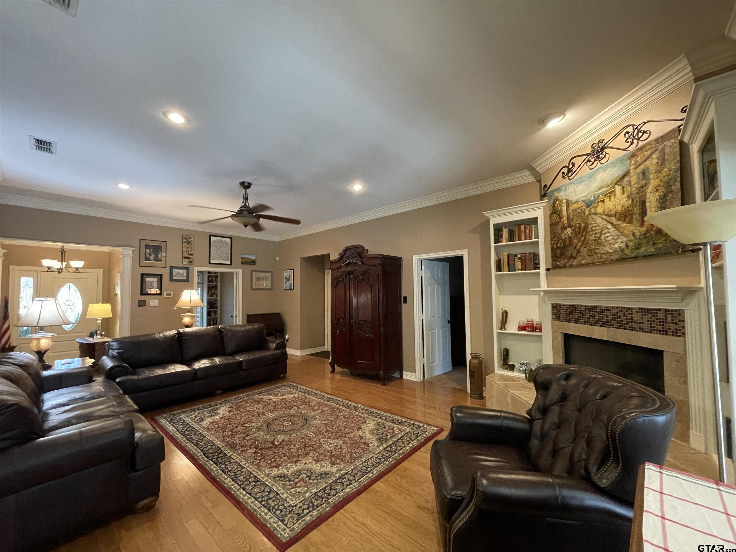 3617 Flagstone Drive Tyler, TX 75707 - Photo 23 of 45 a living room with furniture and a fireplace