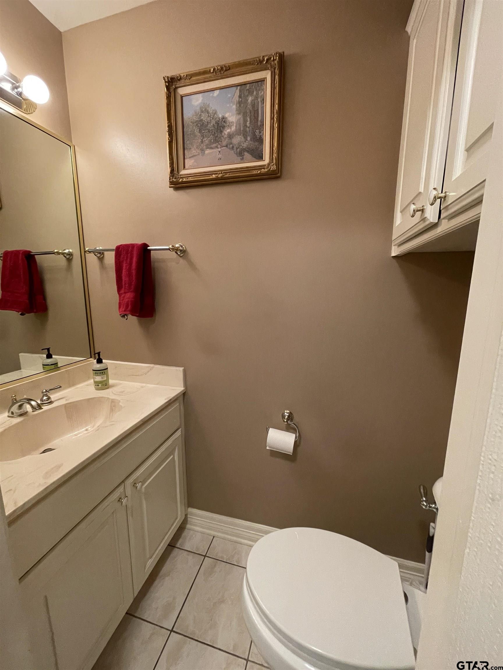 3617 Flagstone Drive Tyler, TX 75707 - Photo 30 of 45 a bathroom with a sink toilet and a mirror