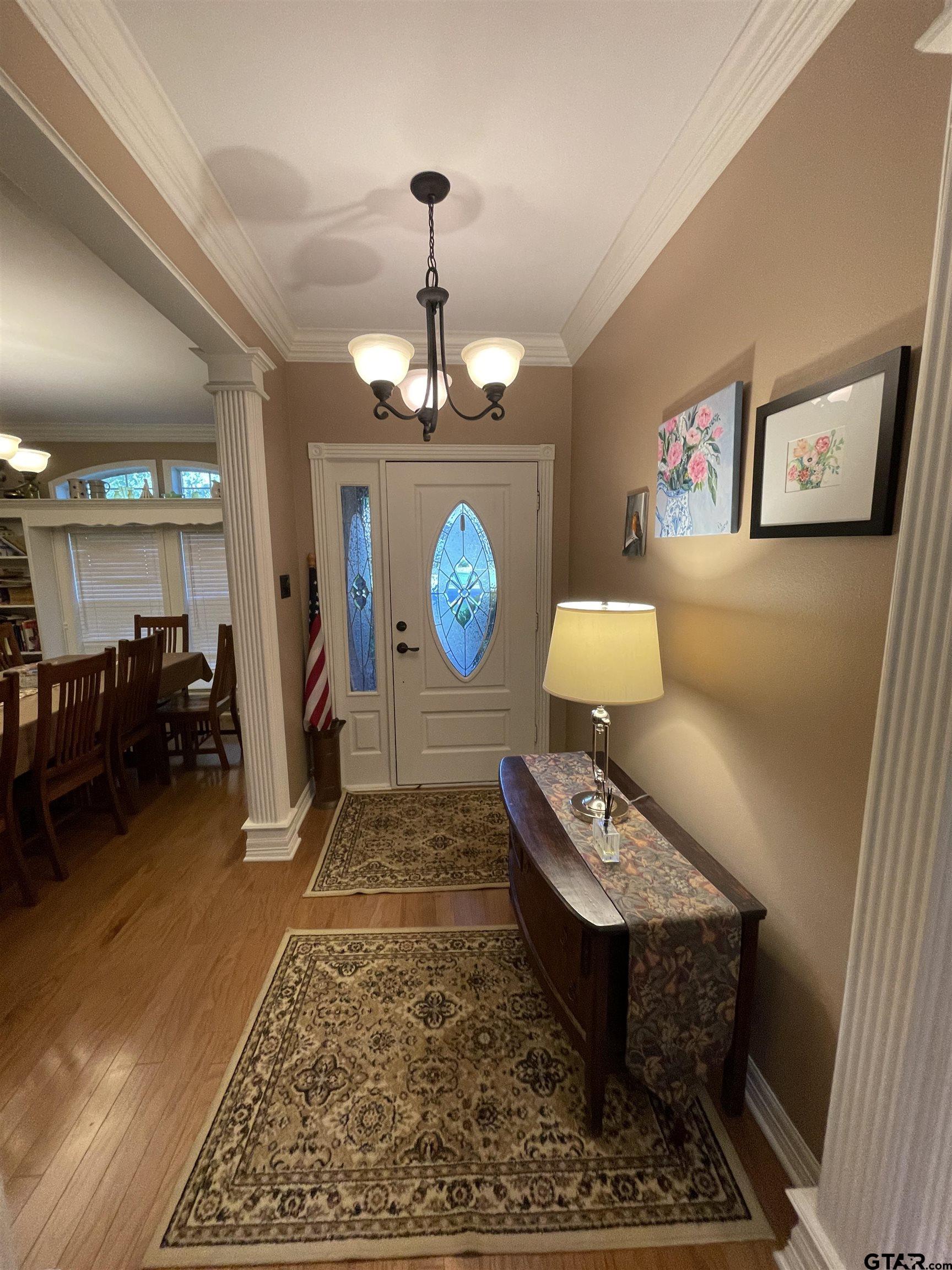 3617 Flagstone Drive Tyler, TX 75707 - Photo 3 of 45 a living room with furniture and a chandelier