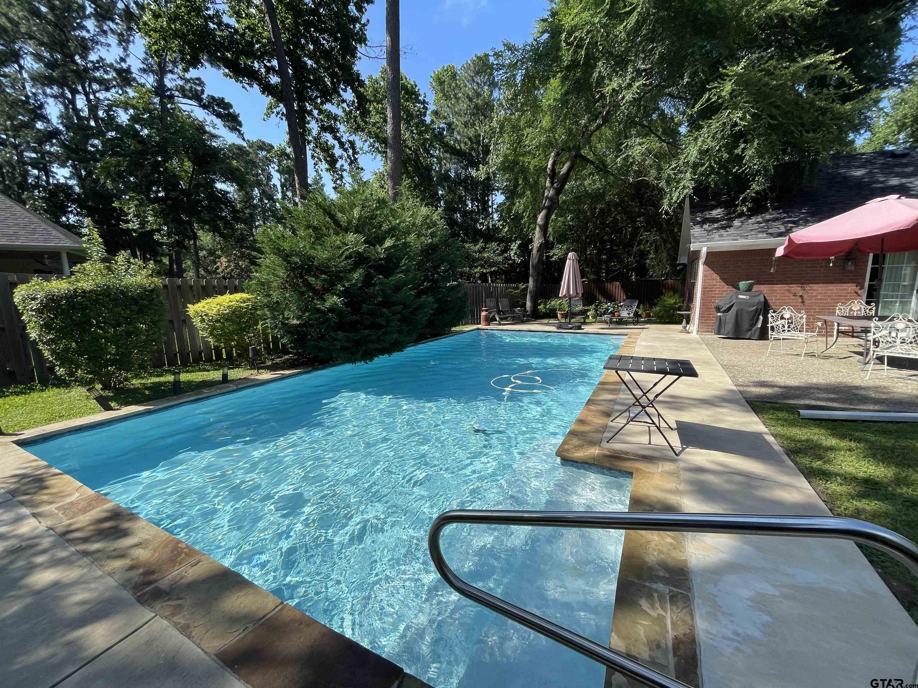 3617 Flagstone Drive Tyler, TX 75707 - Photo 42 of 45 a backyard of a house with yard and trampoline