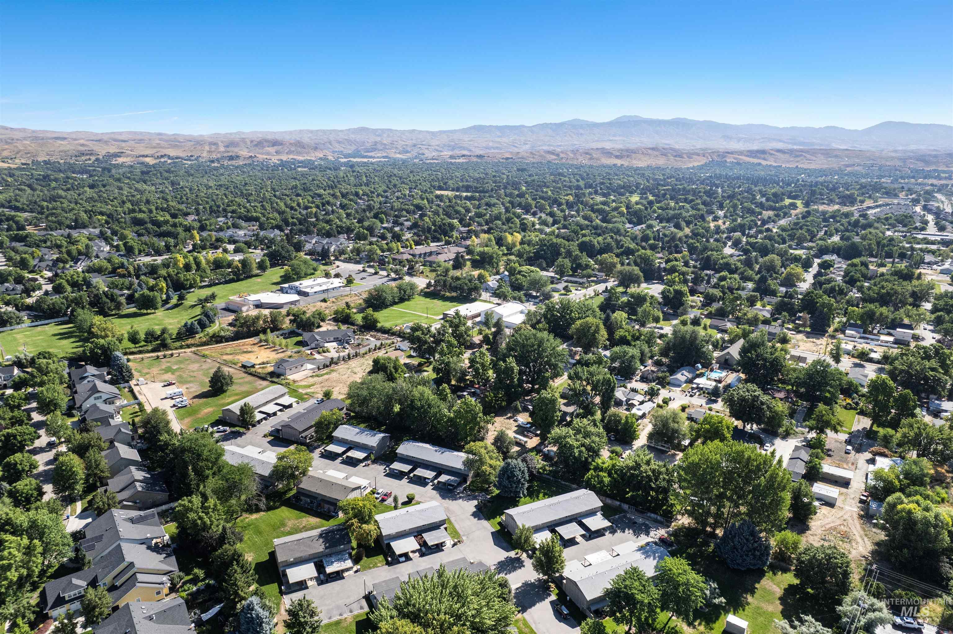 348 North Eagle Road Eagle, ID 83616 - Photo 29 of 31 Aerial perspective of suburban area featuring a mountain backdrop