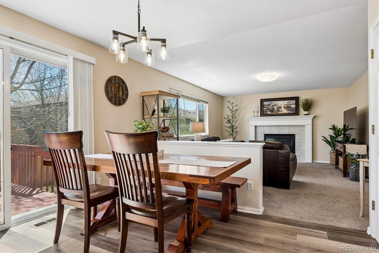 10534 Westcliff Place Highlands Ranch, CO 80130 - Photo 13 of 38 a view of a dining room with furniture window and wooden floor