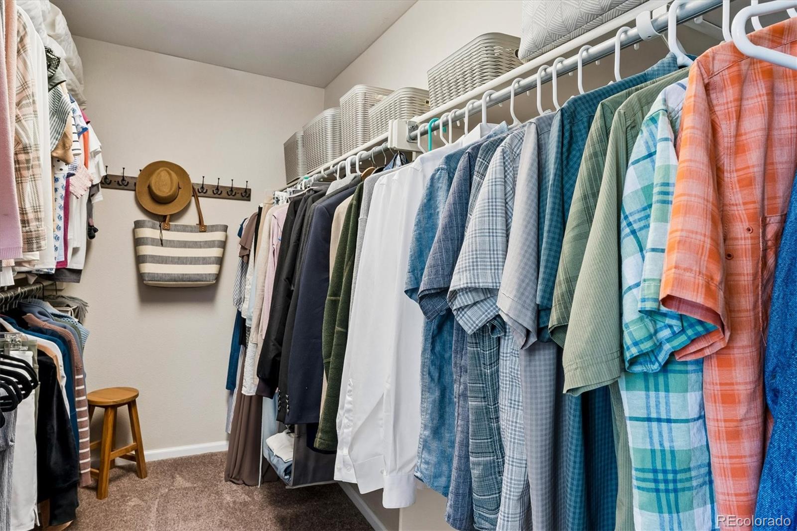 10534 Westcliff Place Highlands Ranch, CO 80130 - Photo 20 of 38 a view of walk in closet with clothes and shoes