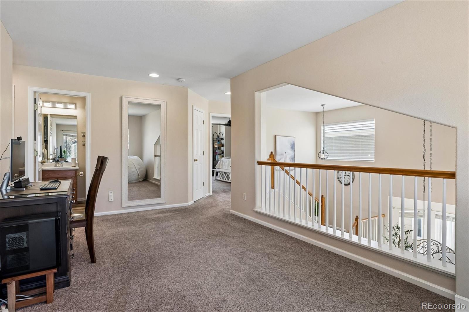 10534 Westcliff Place Highlands Ranch, CO 80130 - Photo 22 of 38 a view of a hallway with workspace