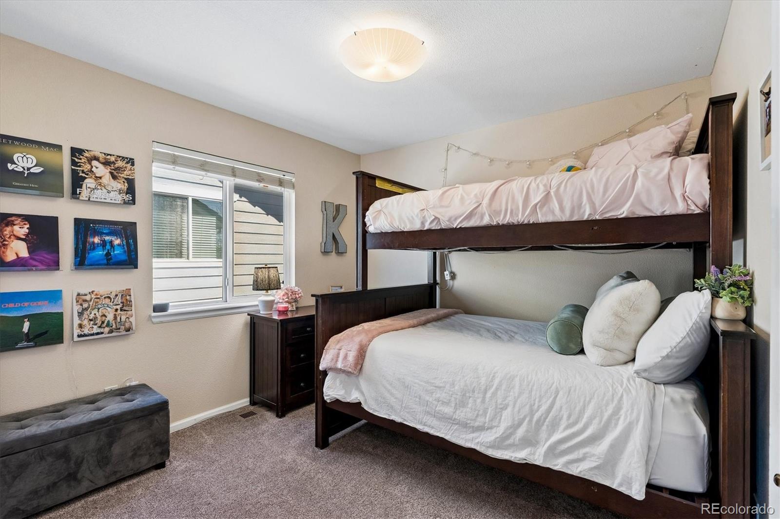 10534 Westcliff Place Highlands Ranch, CO 80130 - Photo 26 of 38 a bedroom with a bed and window