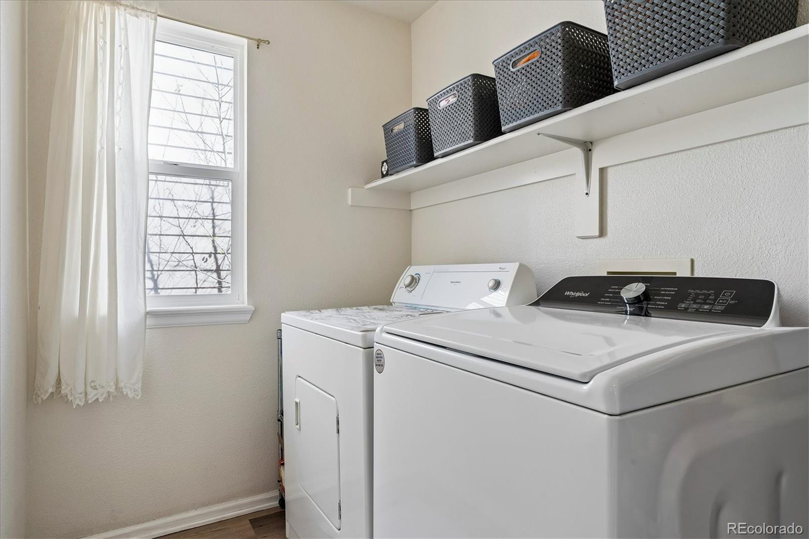 10534 Westcliff Place Highlands Ranch, CO 80130 - Photo 30 of 38 a utility room with dryer and washer