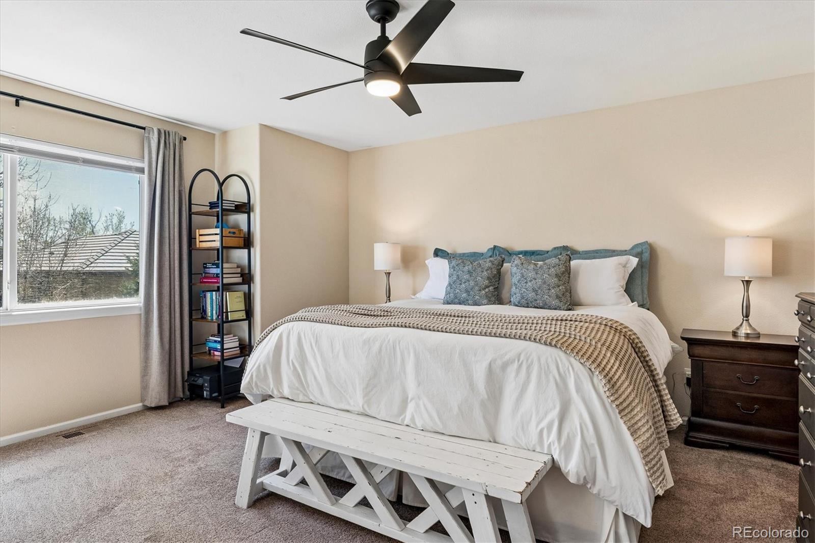 10534 Westcliff Place Highlands Ranch, CO 80130 - Photo 5 of 38 a bedroom with a bed and a window