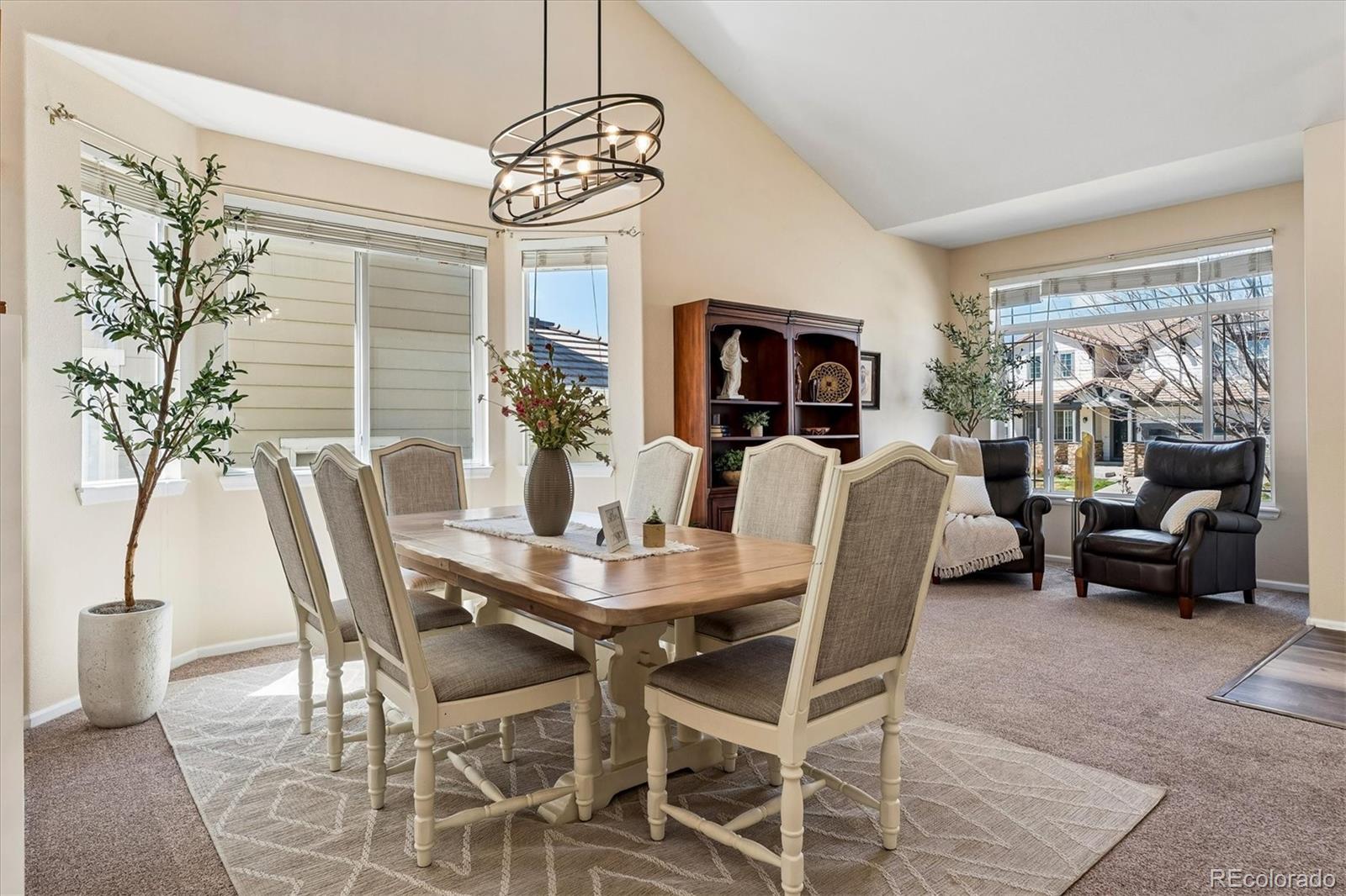 10534 Westcliff Place Highlands Ranch, CO 80130 - Photo 7 of 38 a view of a dining room with furniture window and outside view