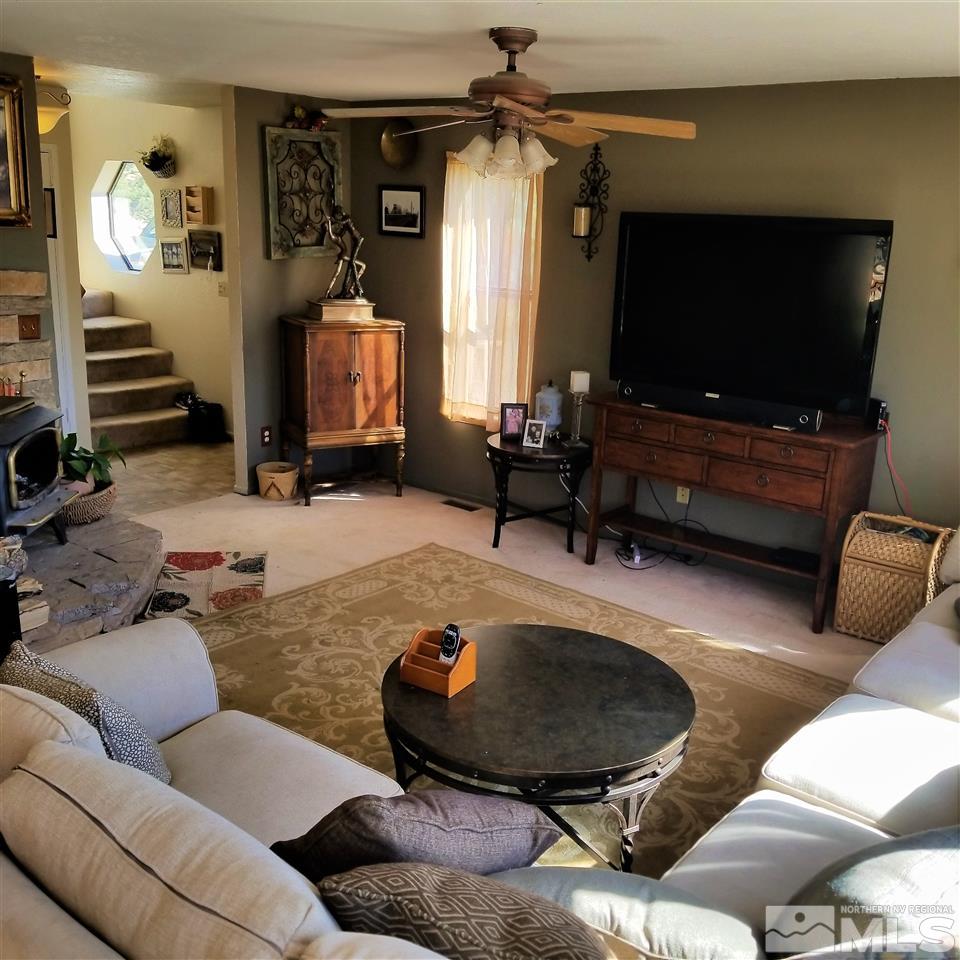 1970 Applegate Road Reno, NV 89521 - Photo 8 of 25 a living room with furniture and a flat screen tv