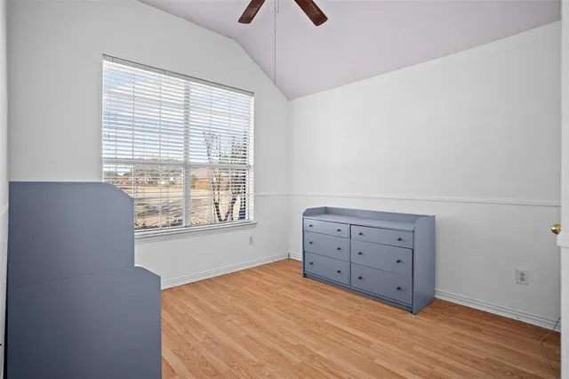 a room with a bed and a window