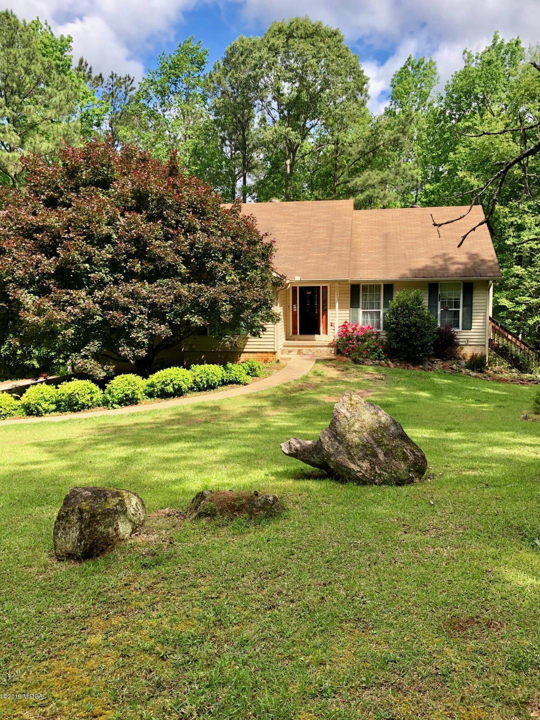 385 Ham Road Jackson, GA 30233 - Photo 14 of 31 a view of a house with a big yard and large trees