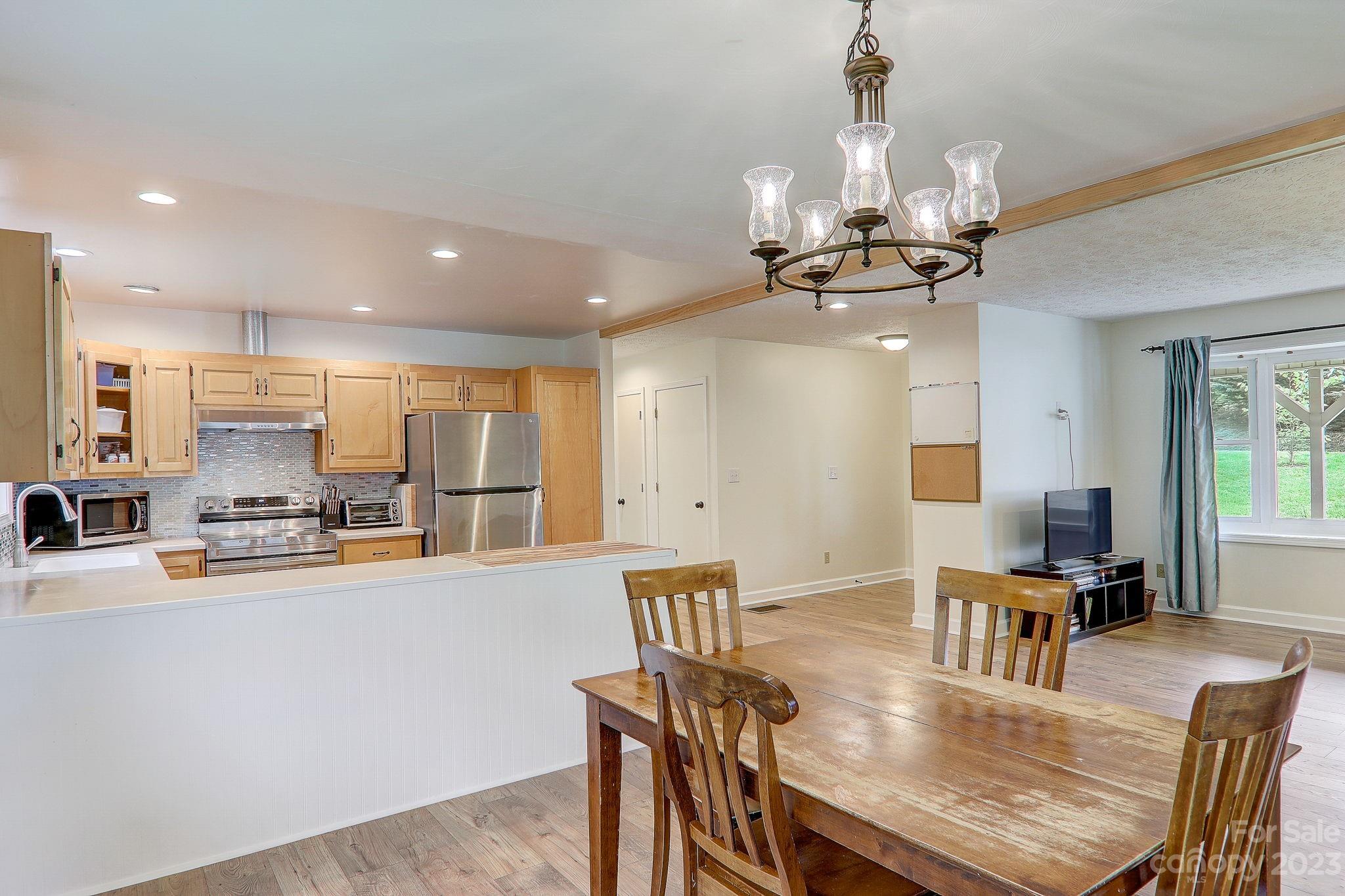 4155 Turnpike Road Horse Shoe, NC 28742 - Photo 11 of 41 a living room with stainless steel appliances kitchen island granite countertop furniture and a kitchen view