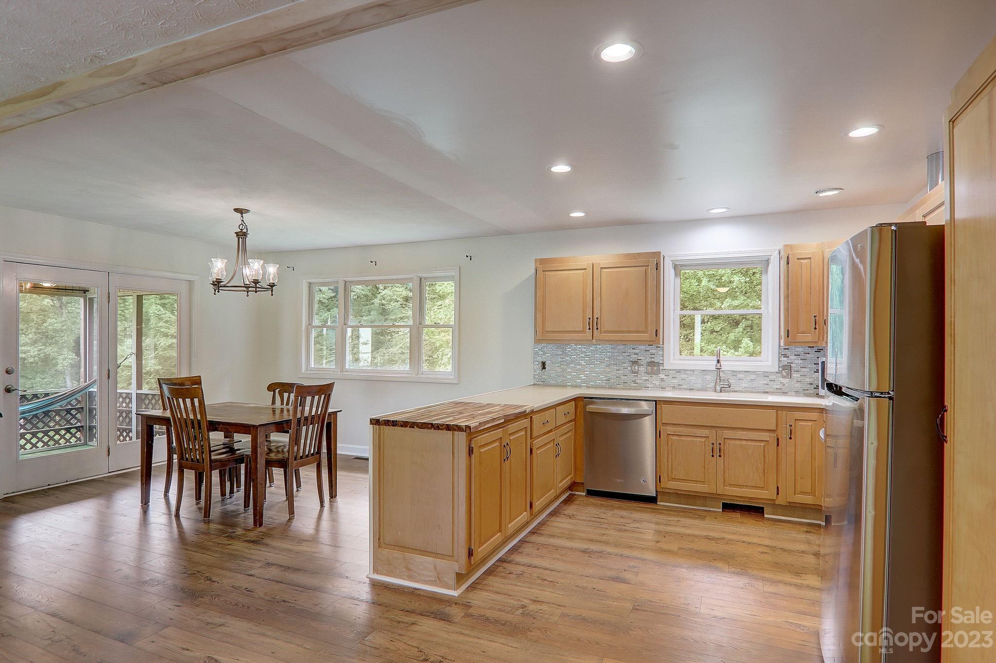 4155 Turnpike Road Horse Shoe, NC 28742 - Photo 14 of 41 a kitchen with lots of counter top space and dining table