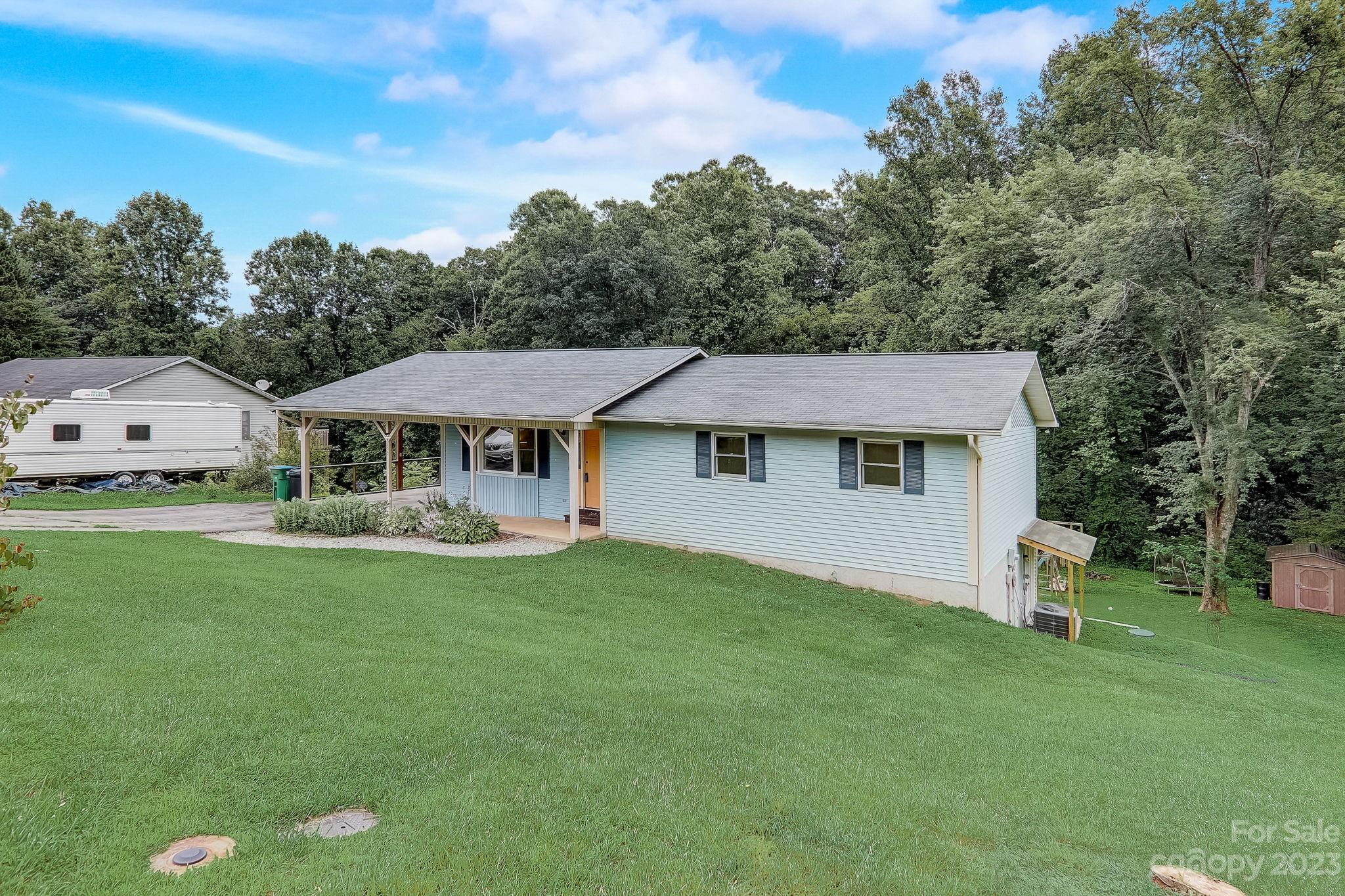 4155 Turnpike Road Horse Shoe, NC 28742 - Photo 2 of 41 a front view of a house with garden