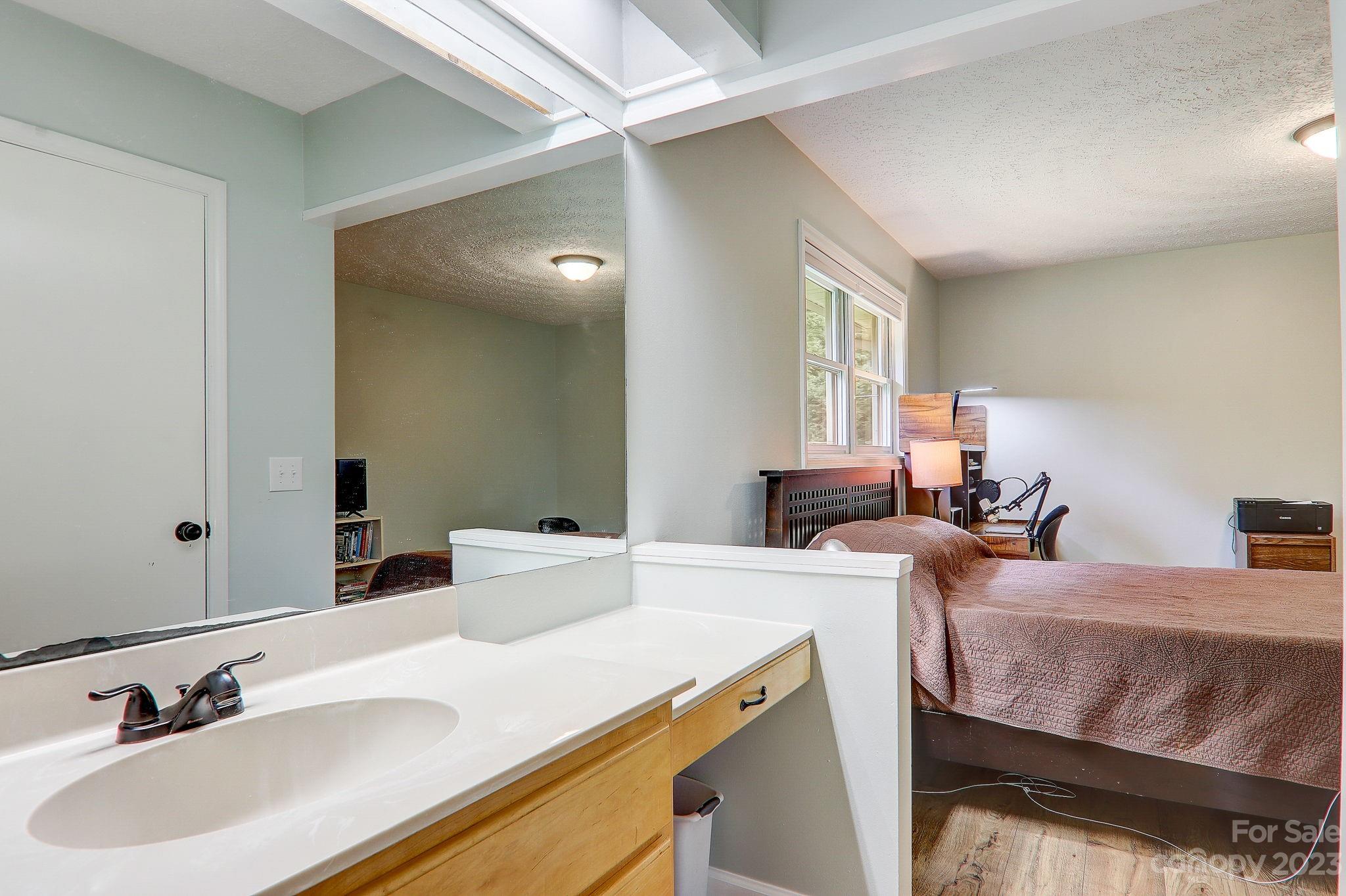 4155 Turnpike Road Horse Shoe, NC 28742 - Photo 21 of 41 a bathroom with a sink and a mirror