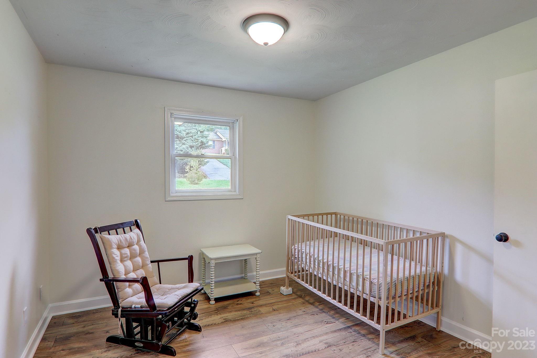 4155 Turnpike Road Horse Shoe, NC 28742 - Photo 22 of 41 a view of a room with lounge chair and wooden floor