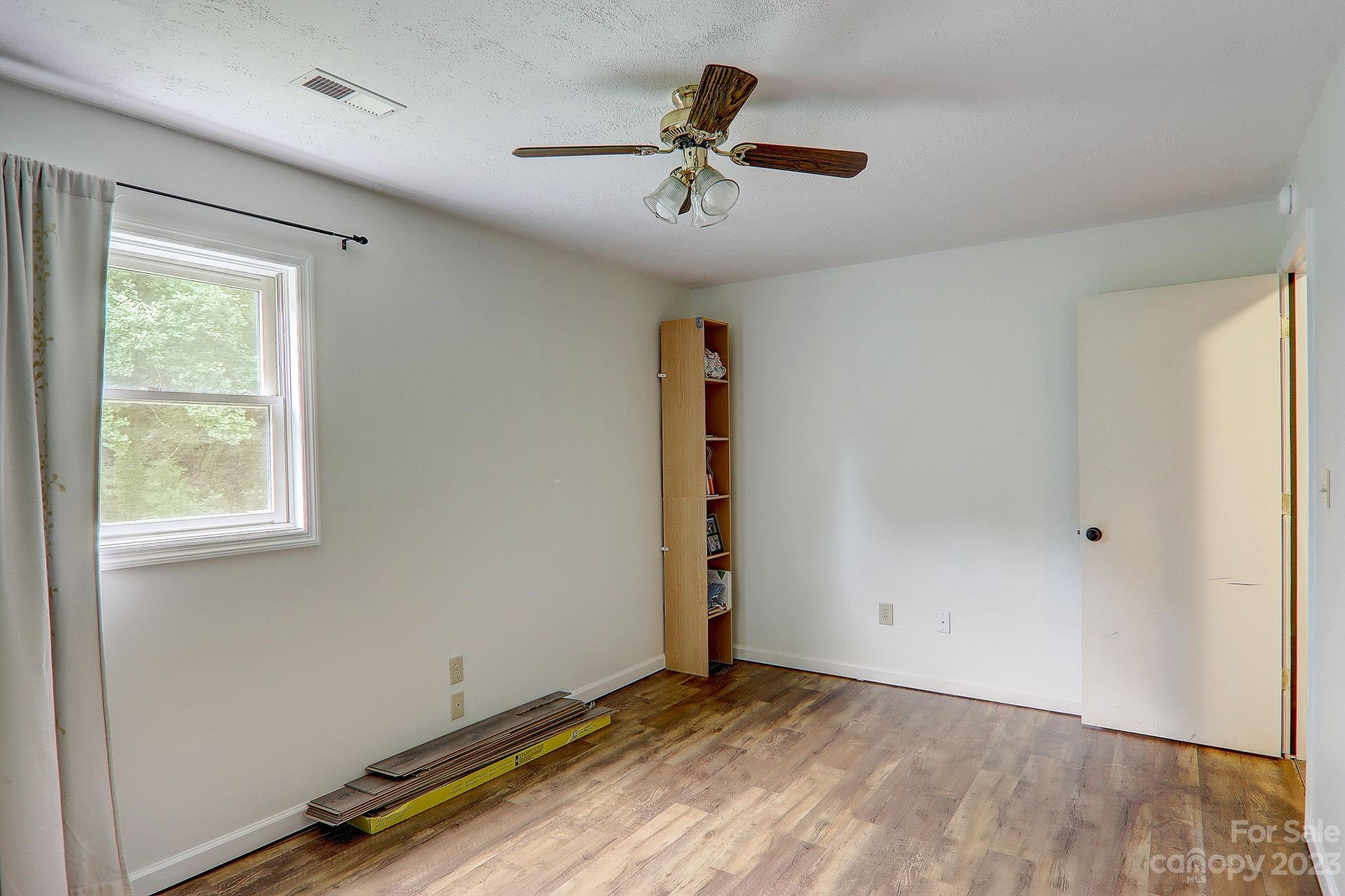 4155 Turnpike Road Horse Shoe, NC 28742 - Photo 30 of 41 a view of room with a ceiling fan and window