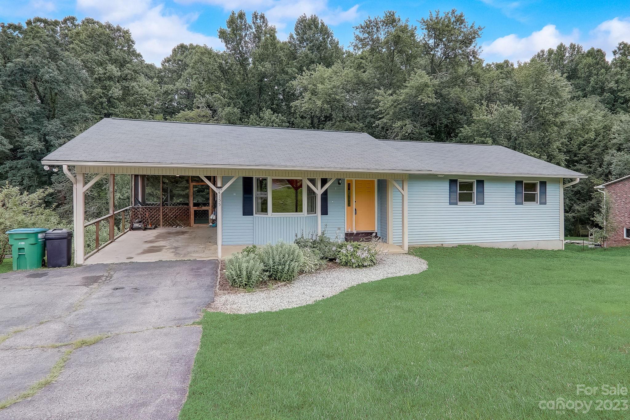 4155 Turnpike Road Horse Shoe, NC 28742 - Photo 3 of 41 a house that has a lot of plants in it