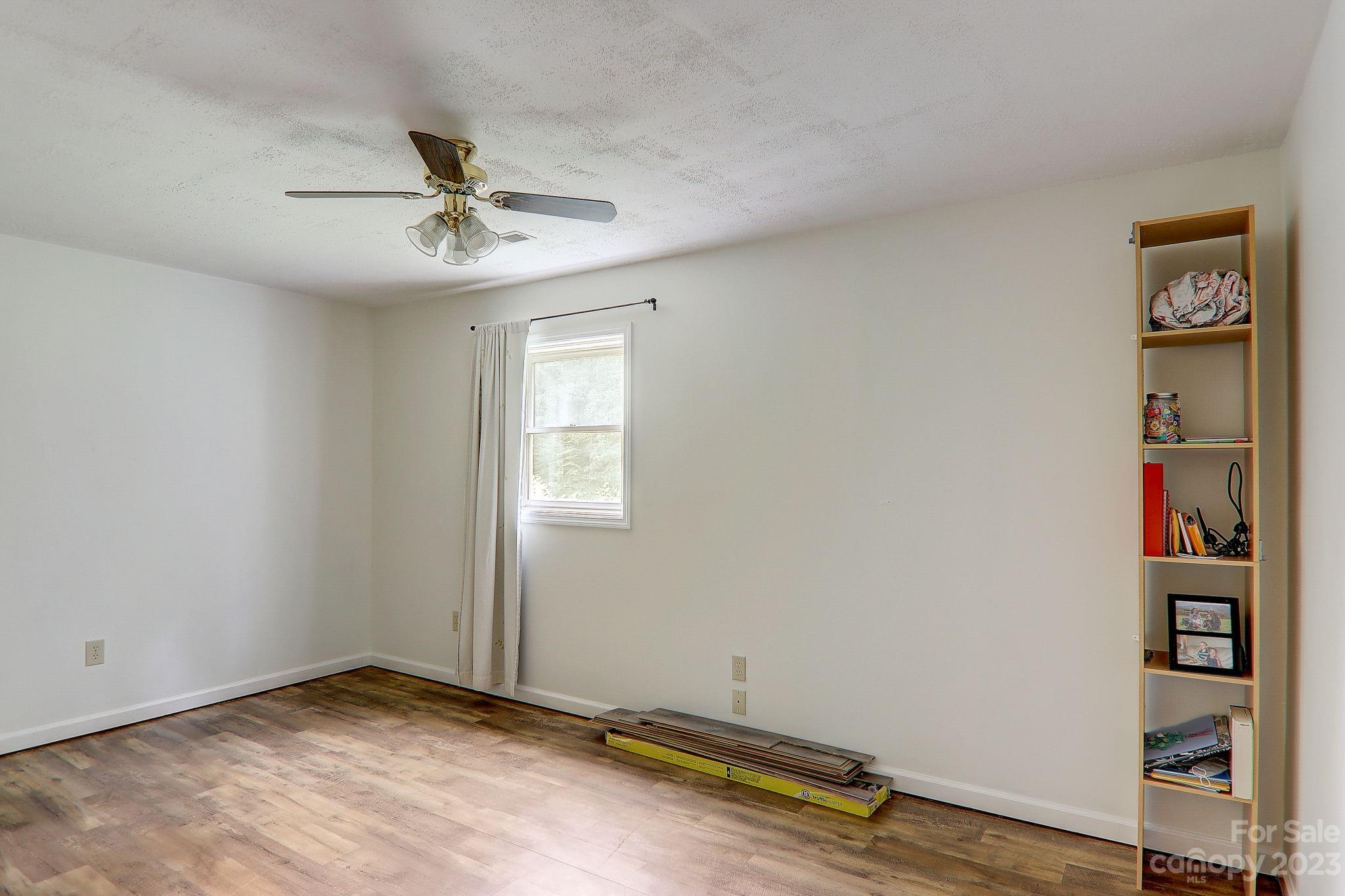 4155 Turnpike Road Horse Shoe, NC 28742 - Photo 31 of 41 an empty room with shelves