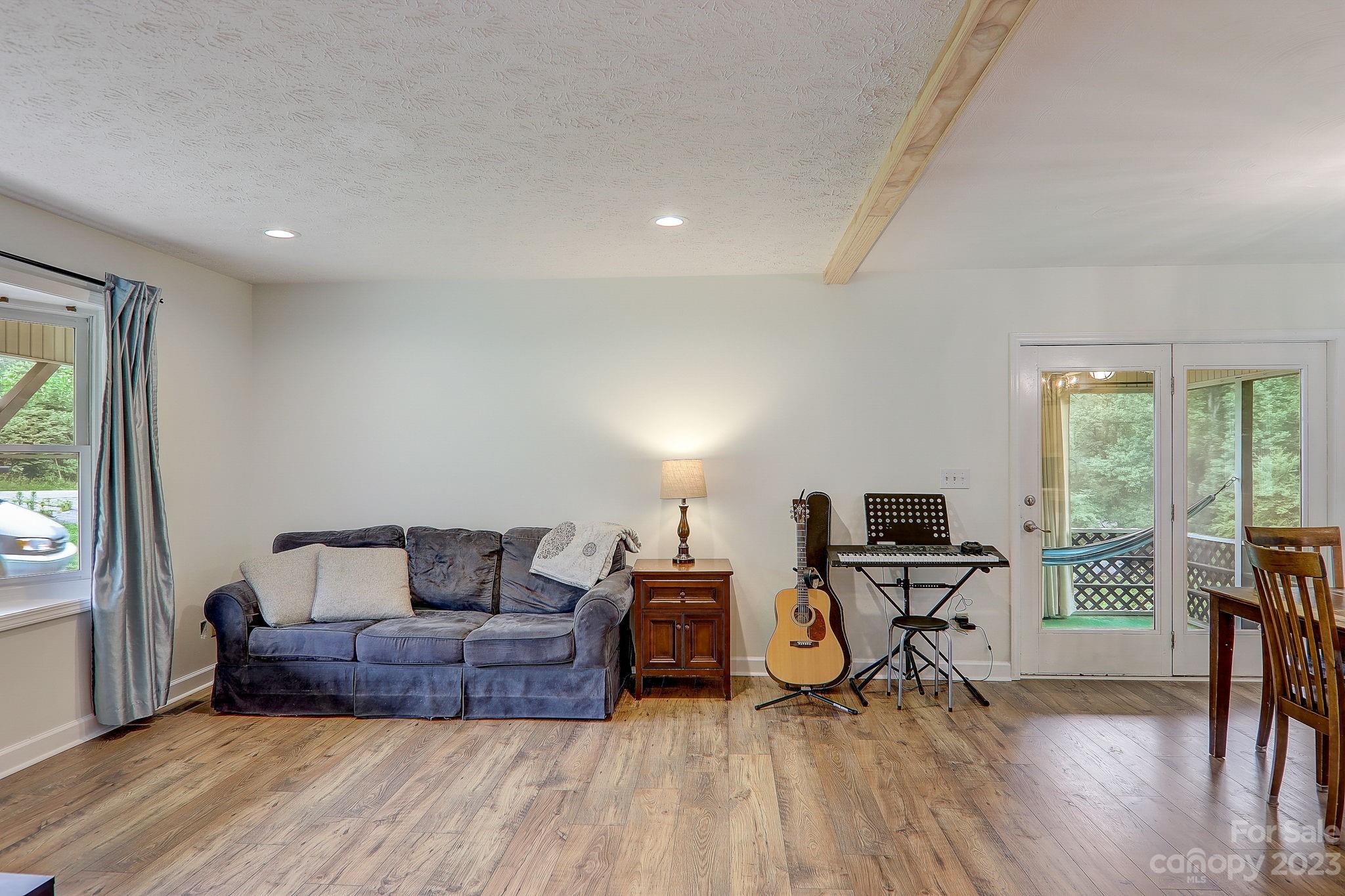 4155 Turnpike Road Horse Shoe, NC 28742 - Photo 7 of 41 a bedroom with furniture and a window