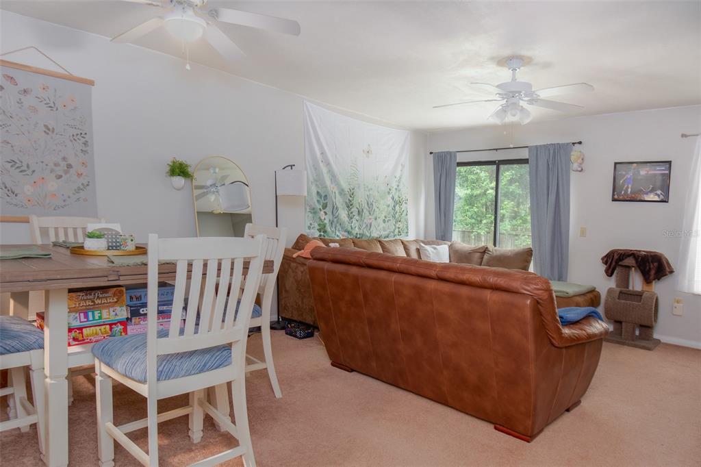 2300 Southwest 43rd Street, Unit K5 Gainesville, FL 32607 - Photo 9 of 18 a living room with furniture and a window