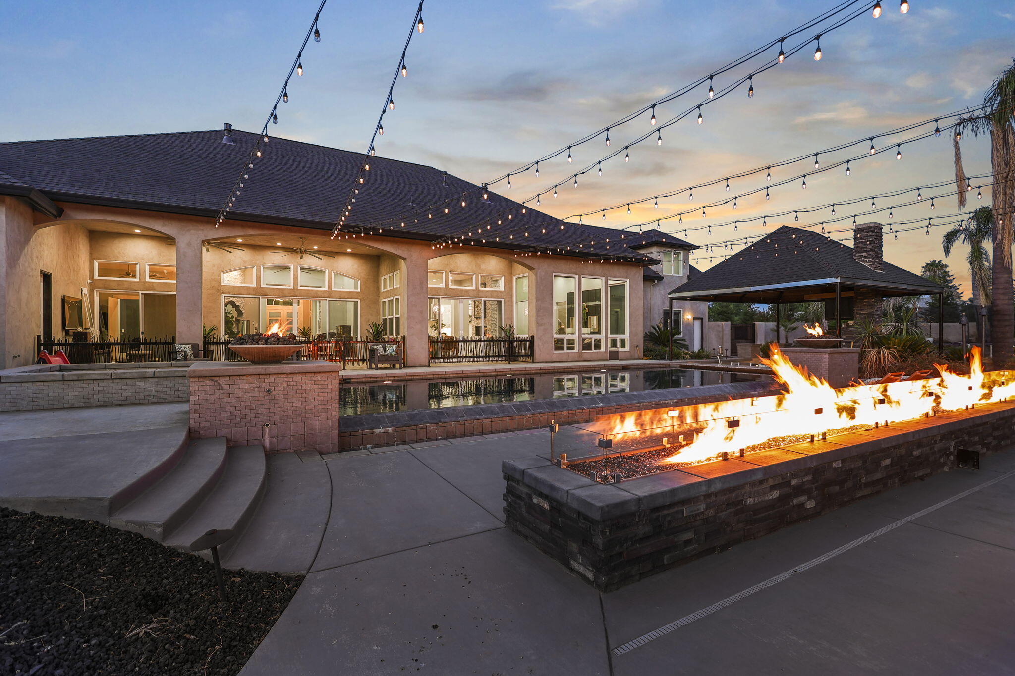 19580 Mockingbird Lane Redding, CA 96002 - Photo 18 of 72 a view of a patio with table and chairs under an umbrella