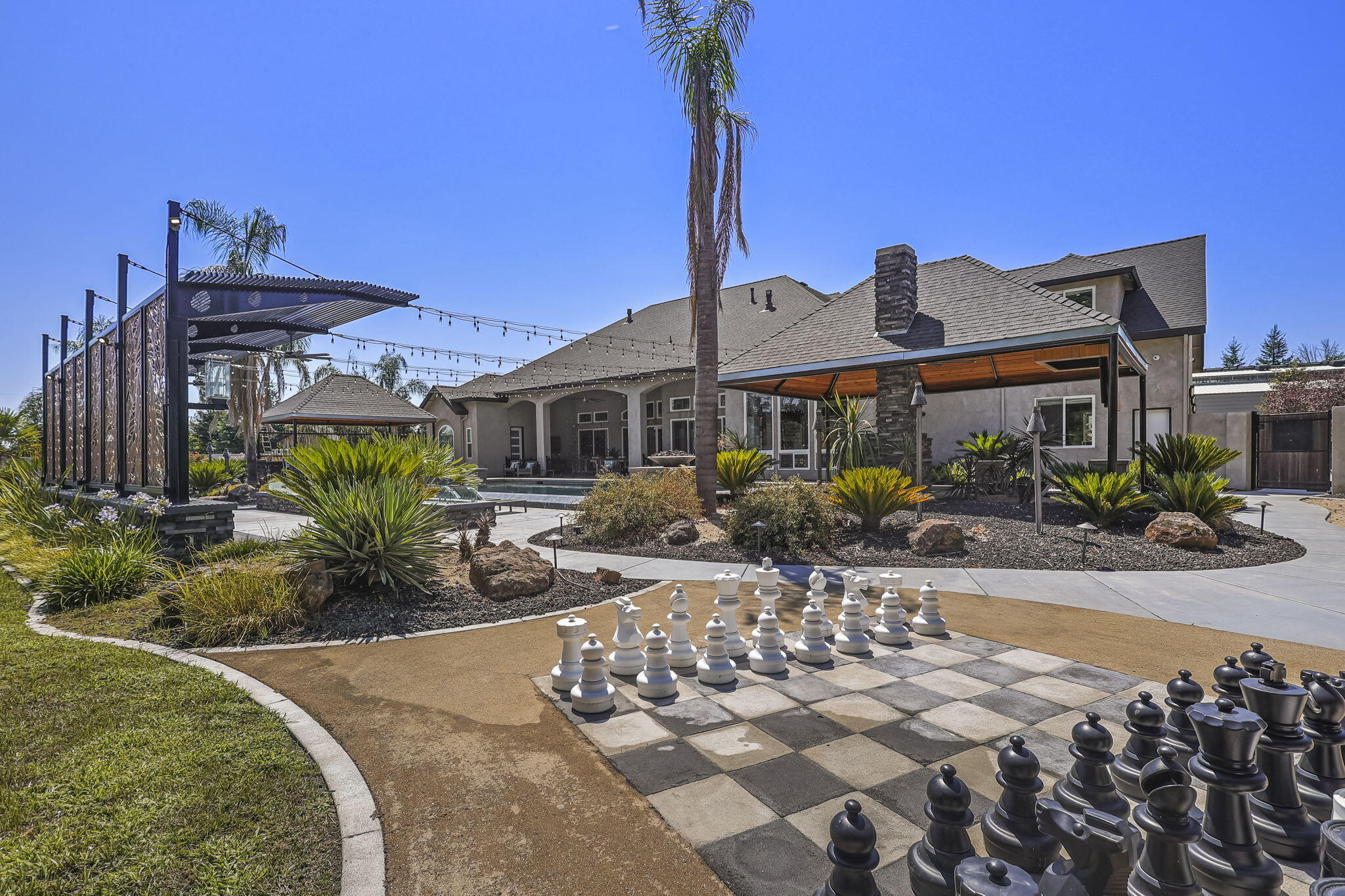 19580 Mockingbird Lane Redding, CA 96002 - Photo 34 of 72 a front view of a house with garden