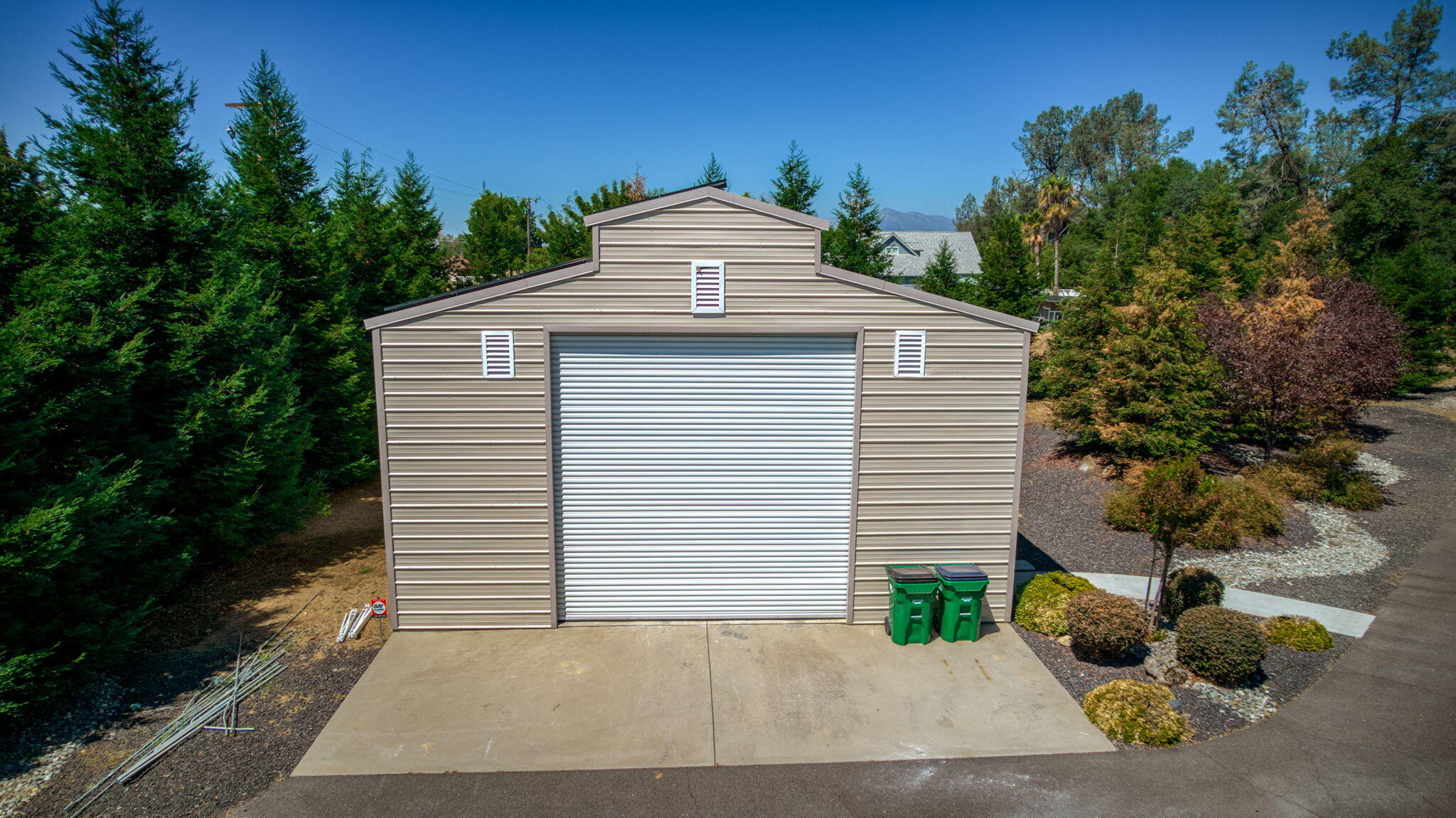 19580 Mockingbird Lane Redding, CA 96002 - Photo 10 of 72 a view of a white house with a yard and large tree