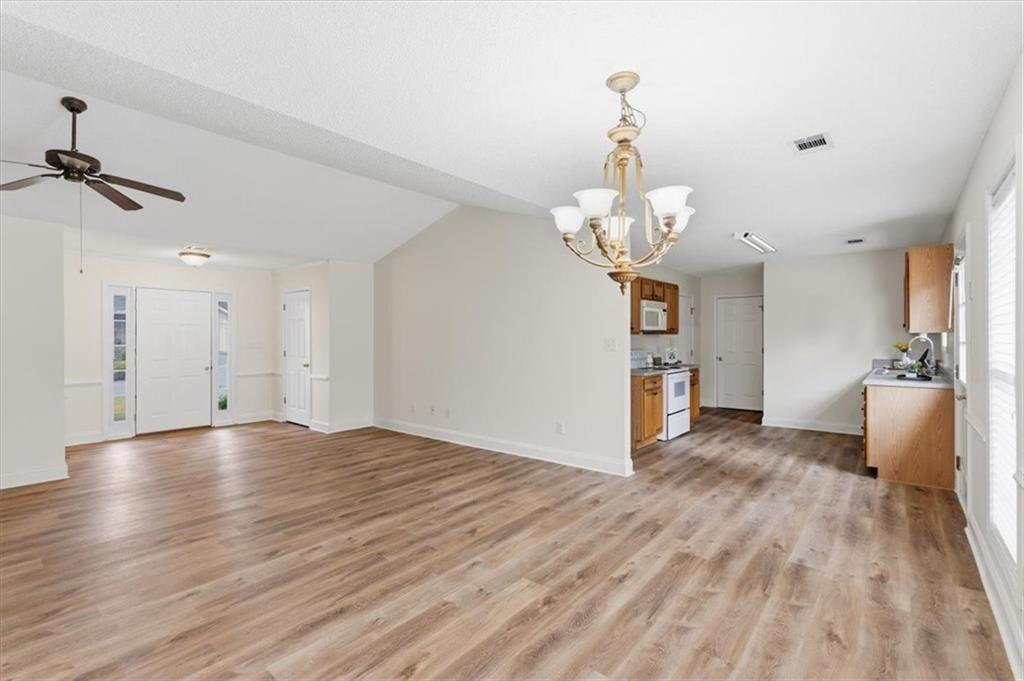 9 Redfern Trail Northeast Rome, GA 30165 - Photo 11 of 19 a view of a room with wooden floor and staircase