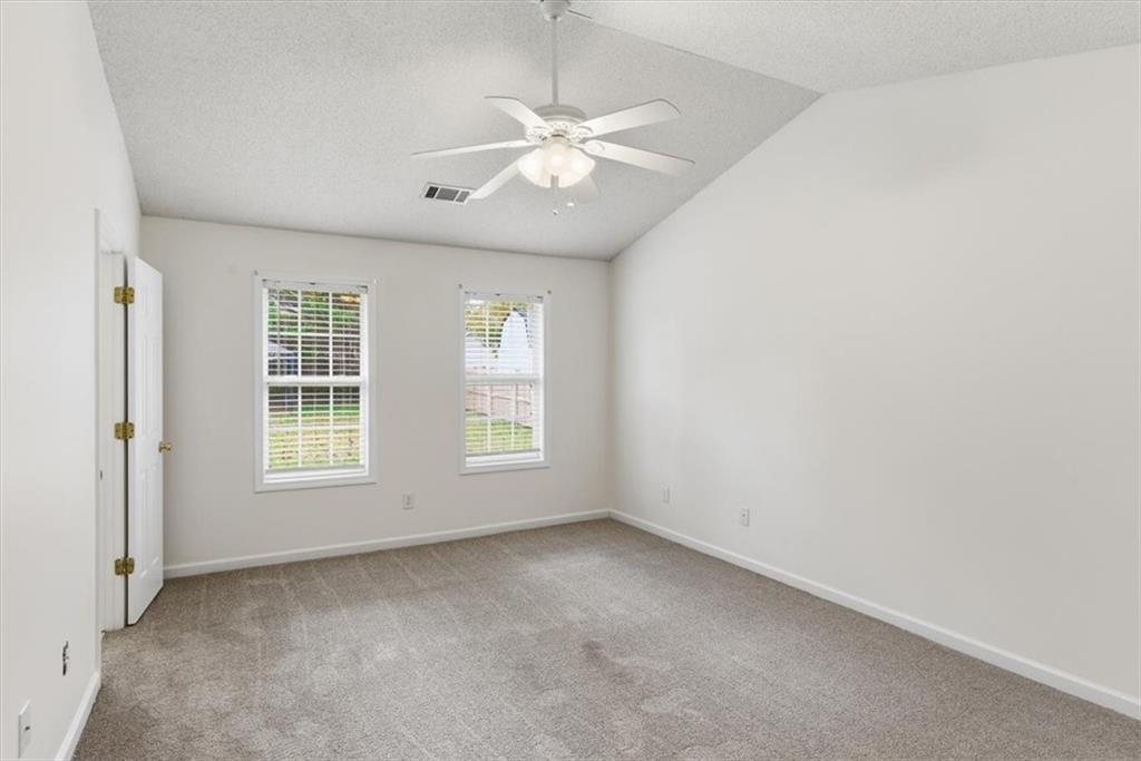 9 Redfern Trail Northeast Rome, GA 30165 - Photo 13 of 19 an empty room with a ceiling fan and window