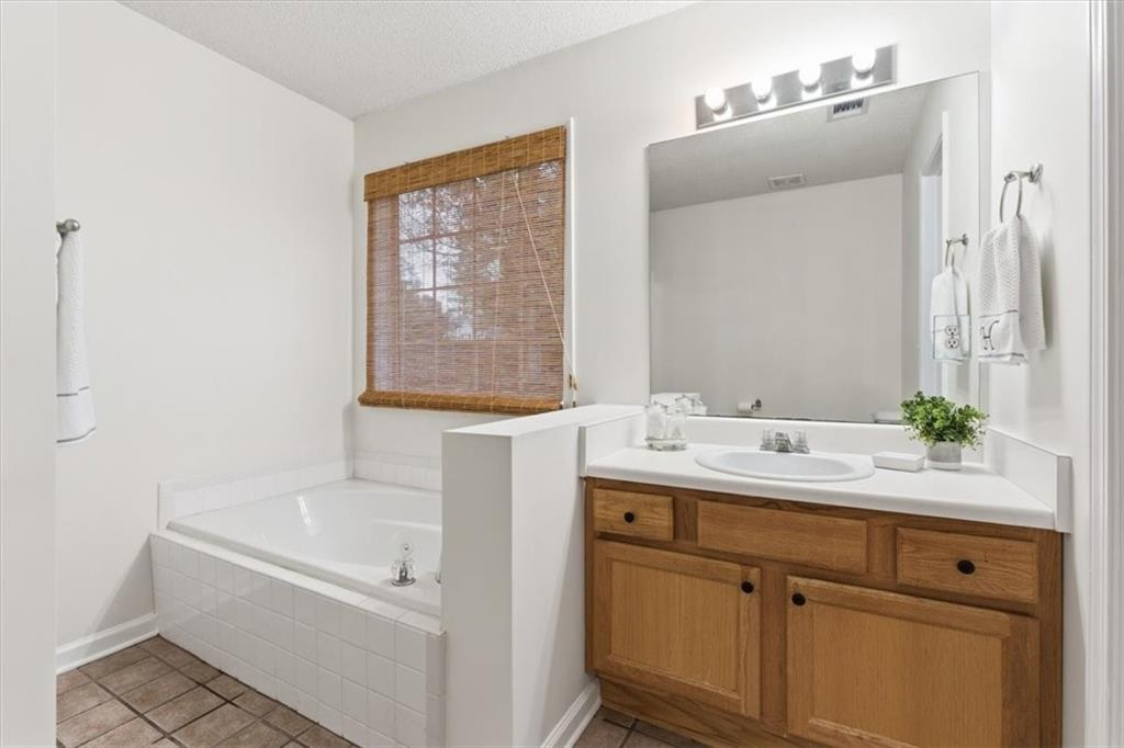 9 Redfern Trail Northeast Rome, GA 30165 - Photo 15 of 19 a bathroom with a sink and a mirror