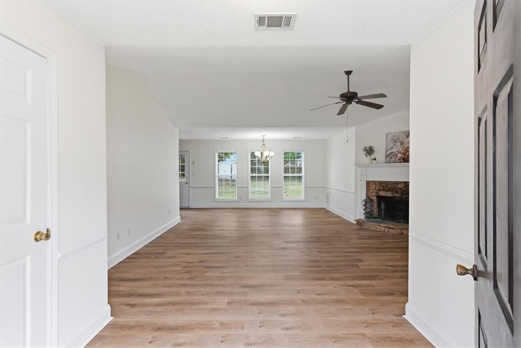 9 Redfern Trail Northeast Rome, GA 30165 - Photo 2 of 19 a view of an empty room with wooden floor and a window