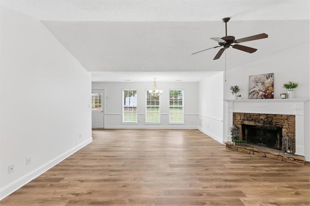 9 Redfern Trail Northeast Rome, GA 30165 - Photo 3 of 19 a view of empty room with wooden floor and fireplace
