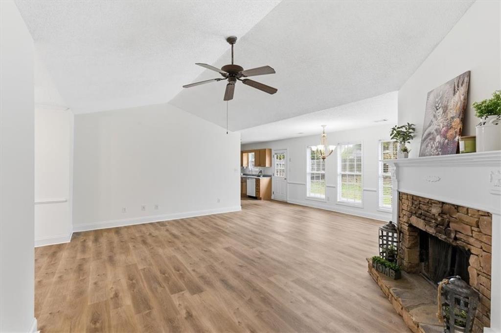 9 Redfern Trail Northeast Rome, GA 30165 - Photo 5 of 19 a view of empty room with wooden floor and fireplace