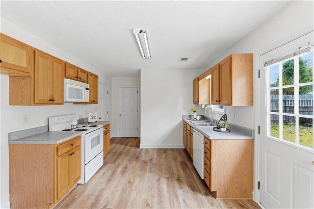 9 Redfern Trail Northeast Rome, GA 30165 - Photo 6 of 19 a kitchen with stainless steel appliances a sink stove and cabinets