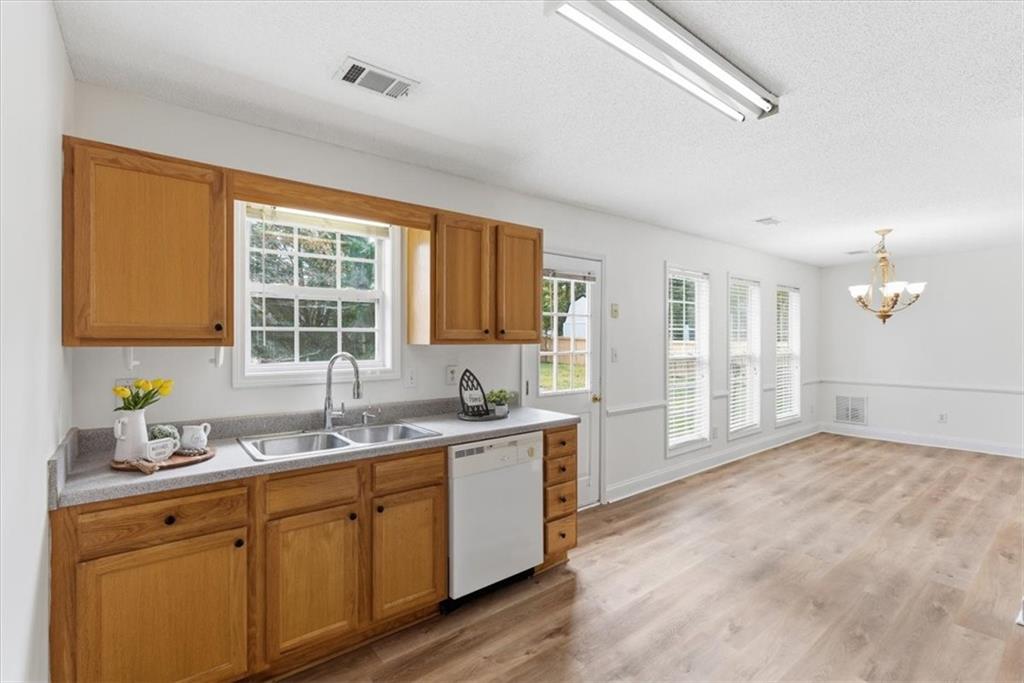 9 Redfern Trail Northeast Rome, GA 30165 - Photo 8 of 19 a kitchen with a sink stove and cabinets