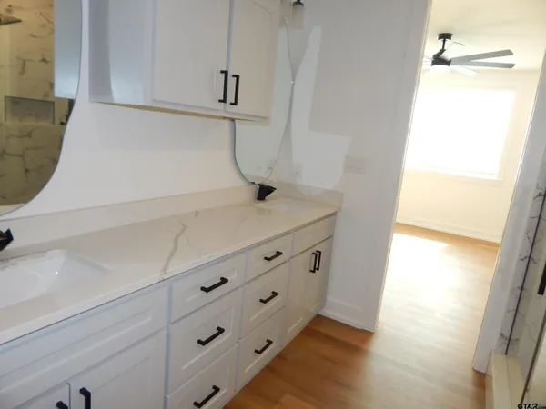 a view of cabinets and wooden floor