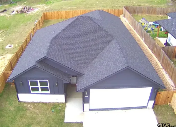 a view of a backyard of the house