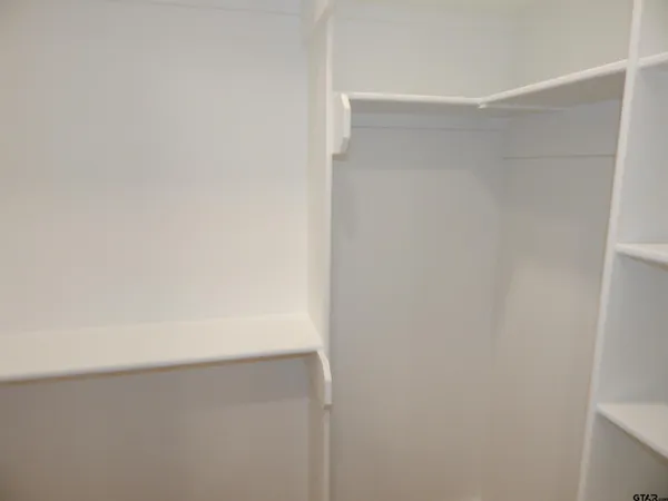 a view of empty room with windows