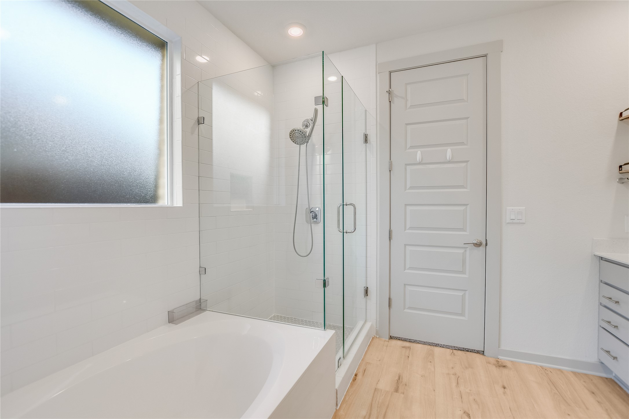 2244 Alamar Walk Leander, TX 78641 - Photo 8 of 22 a bathroom with a bathtub and shower