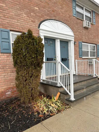 a front view of a house with a porch